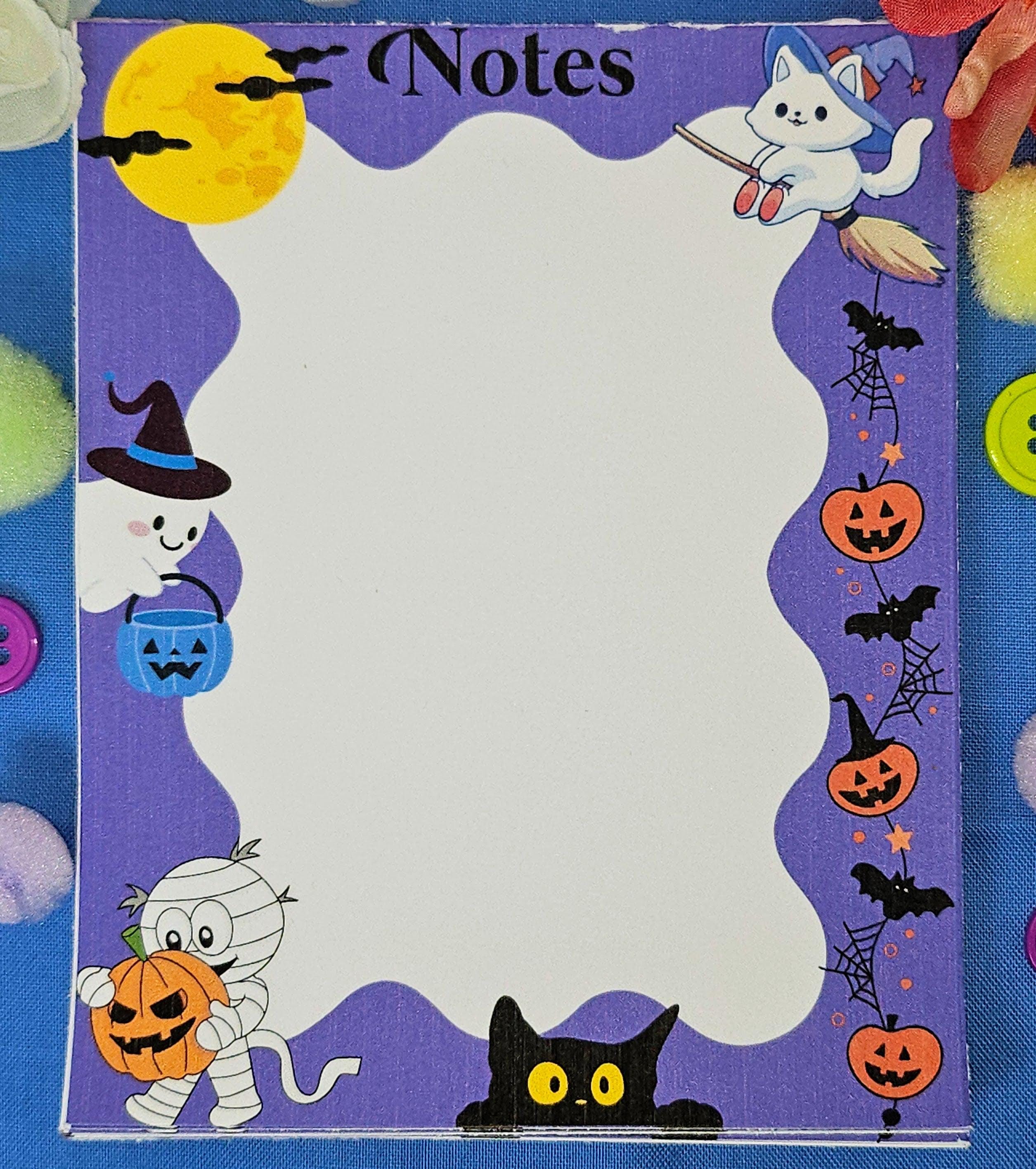 Cute Halloween notepad with ghosts, cats, pumpkins, and bats for fall journaling and notes.