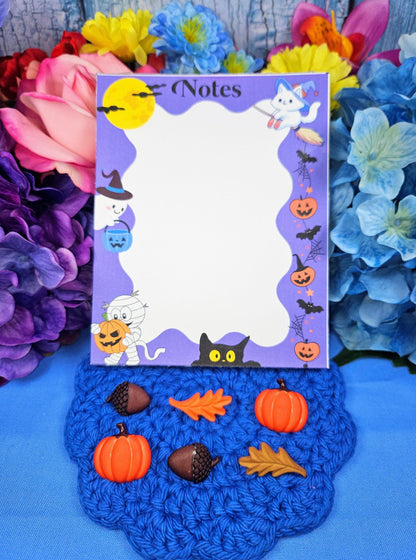 Cute Halloween notepad with ghosts, cats, pumpkins, and bats for fall journaling and notes.