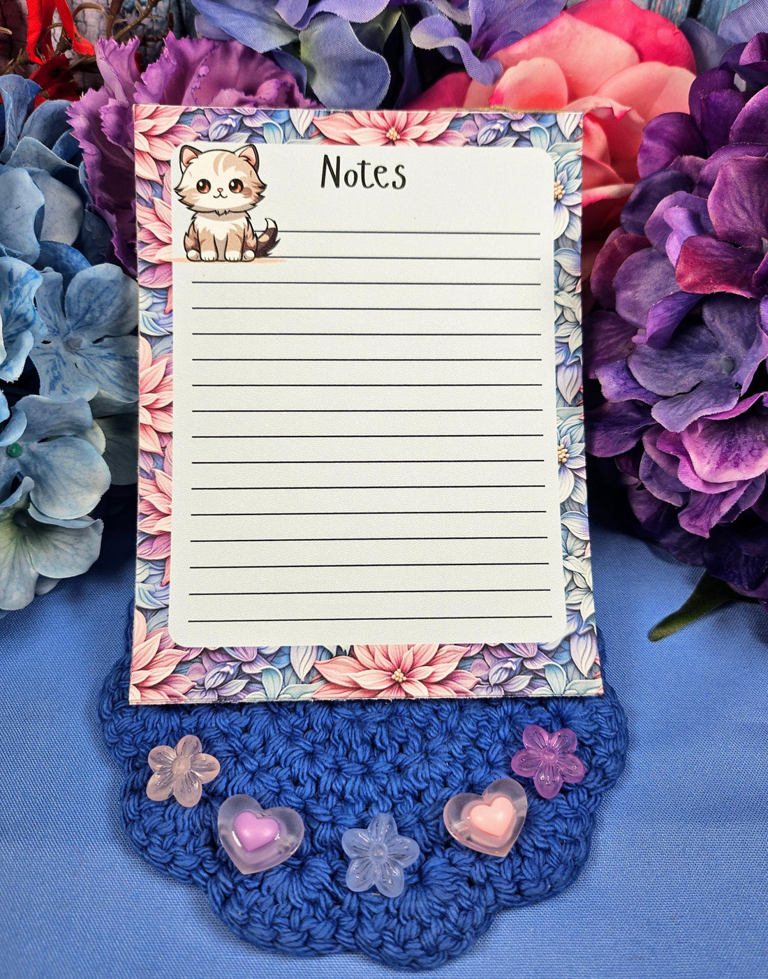 Cute cat notepad with pastel floral border for note taking and journaling.