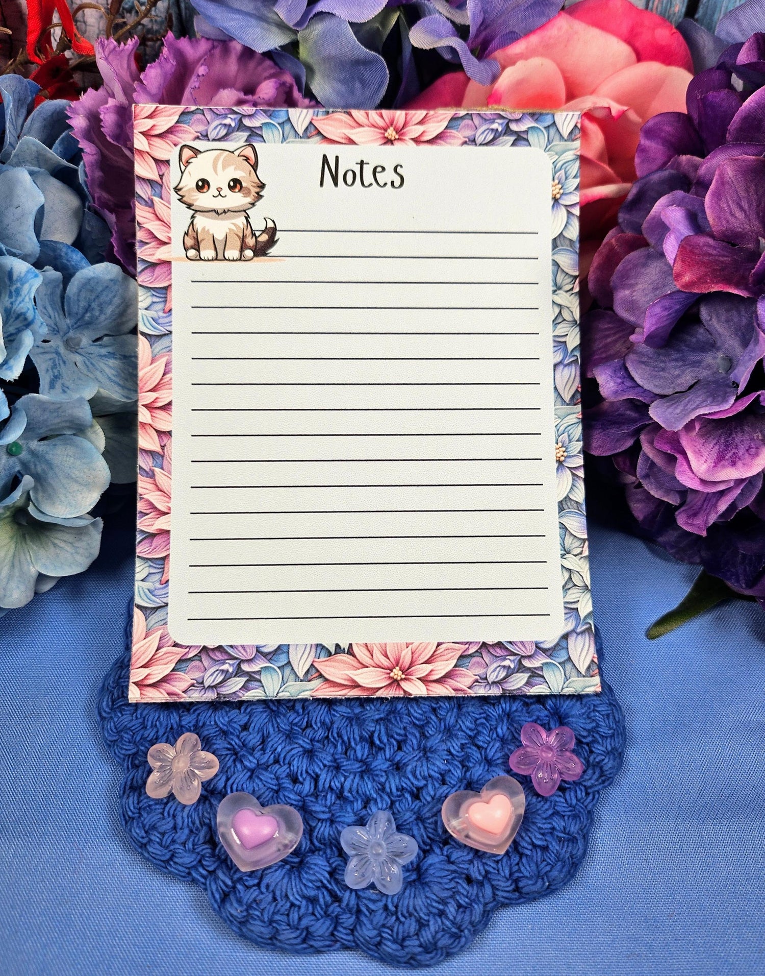 Cute cat notepad with pastel floral border for note taking and journaling.