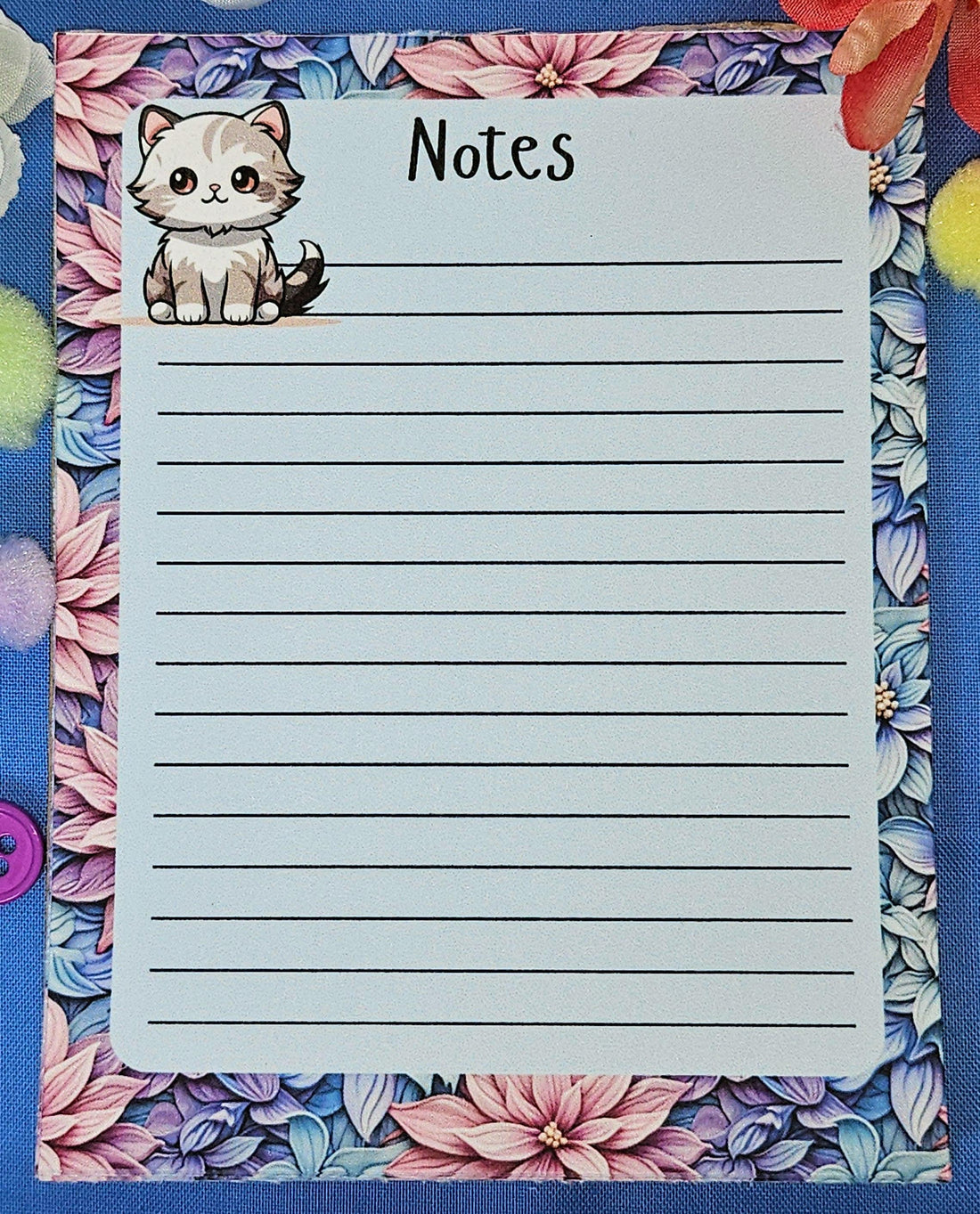 Cute cat notepad with pastel floral border for note taking and journaling.